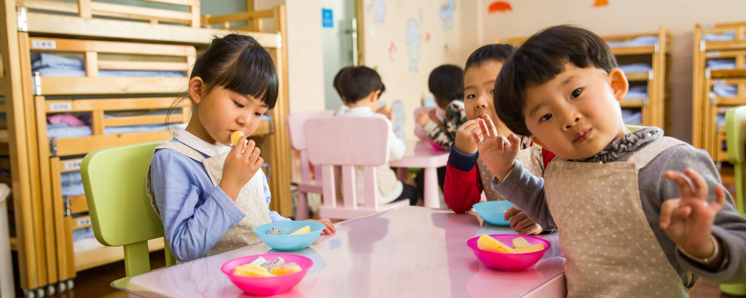 Children in classroom with food