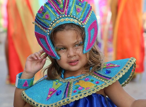 Little girl in costume participating in the parade